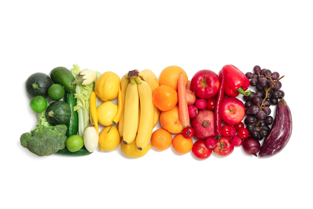 Rainbow composition with fresh vegetables and fruits on white ...